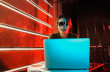 Young woman watching video on laptop