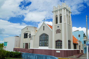 Traditional Church Architecture Under a Cloudy Blue Sky San Juan, Puerto Rico 