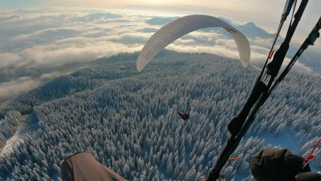 Paragliding adrenaline flying above winter wonderland, freedom outdoor adventure