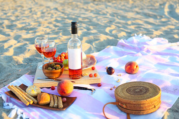 Picnic outdoor with rose wine fruits meat and cheese
