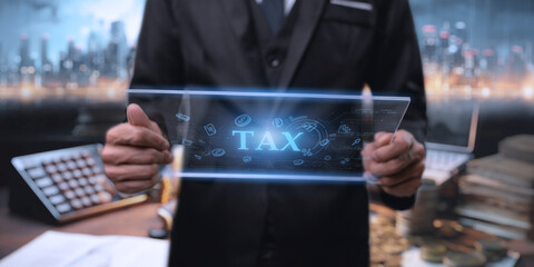 Calculation tax return, e-tax, Businesman show TAX for Individual income tax return form online for tax payment concept. . Data analysis, paperwork, financial research, Government, state taxes