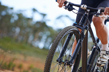 Hands, bicycle and gear in nature for cycling adventure on off road terrain for extreme sport,...