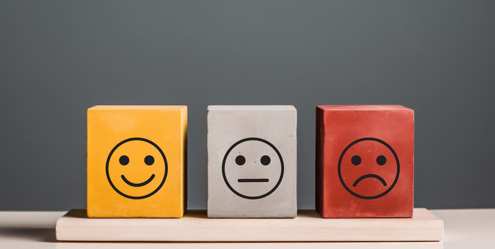 wooden block with smile and sad face, customer relation concept