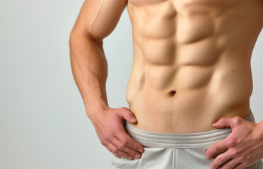 Fototapeta premium Athletic, flat male belly close-up.