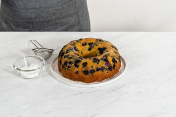 Lemon blueberry bundt cake with powdered sugar dusting