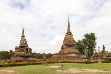 Fototapeta na wymiar Wat Sa Si temple and buddha statue, Shukhothai Historical Park, Thailand, one of UNESCO Heritage Site