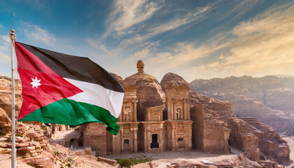 Jordan flag waving on the wind against Petra and Jordan city