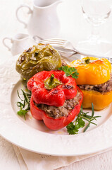 Traditional German stuffed bell peppers with minced meat served as close-up on a classic design plate