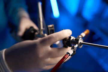 Selective focus of hysteroscope in hands of partial doctor in blurred clinic