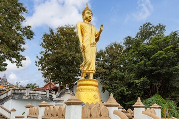 The iconic standing Buddha in Wat Phra That Khao Noi, one of the most tourist attraction...