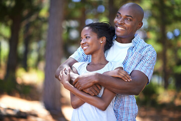 Hug, thinking or black couple hiking in forest to relax or bond on holiday vacation together in...