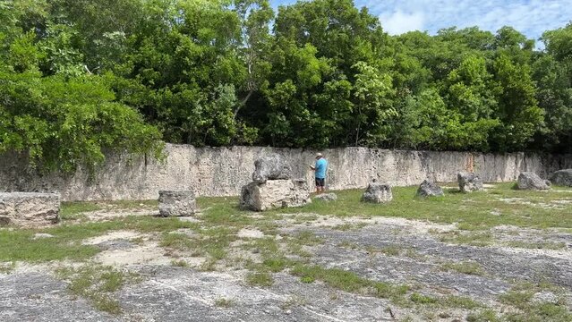 A man walking in the fossil area at Windley Key Fossil Reef Geological State Park in Islamorada, Florida.