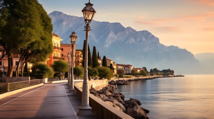 Fototapeta na wymiar City of Riva del Garda by Garda lake in Italy. View from the promenade to see in the early morning