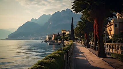 City of Riva del Garda by Garda lake in Italy. View from the promenade to see in the early morning - obrazy, fototapety, plakaty