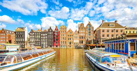 Amsterdam city skyline and dancing houses over Damrak canal, Netherlands - obrazy, fototapety, plakaty