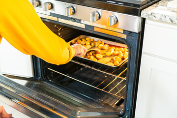 Roasting Halved Mixed Marble Potatoes in Modern Kitchen