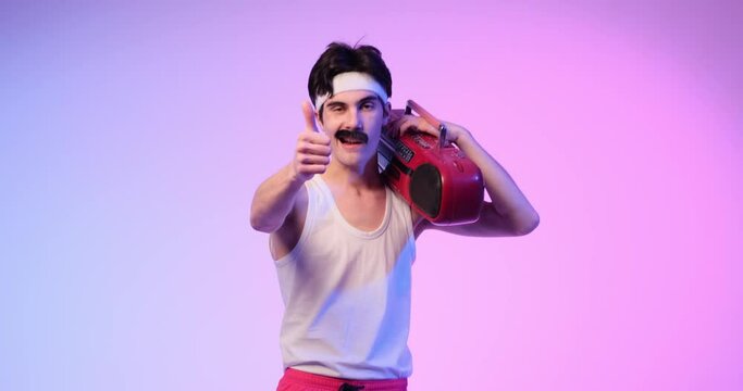 Smiling mustached 80s man, holding a cassette player, enthusiastically gives a thumbs up gesture on purple background. This scene radiates retro positivity and adds a touch of vintage coolness.