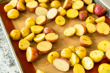 Roasting Halved Mixed Marble Potatoes in Modern Kitchen