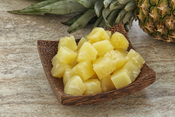 Marinated pineapple slices in the bowl