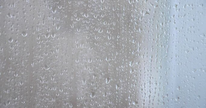4k heavy Rain Drops Falling down on window glass
