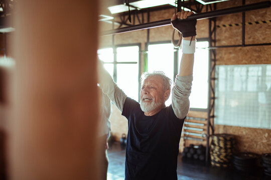 Senior Man Working Out In Gym