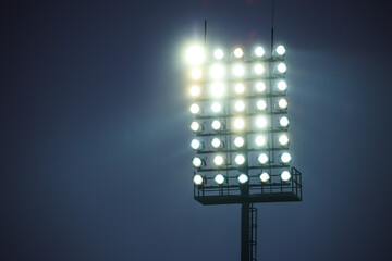 Floodlight for the football field, many lamps in the twilight