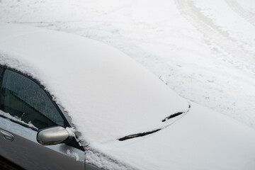 Winter Driving Tips: How to Clear Ice and Snow from a Car Windshield with a Scraper. Car exterior...