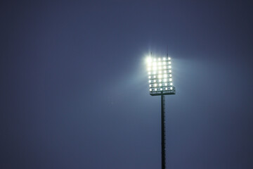 Floodlight for the football field, many lamps in the twilight