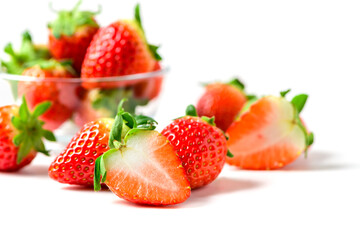 Sliced Strawberries with leaf isolate. Whole and half of strawberry on white. Strawberries isolate....