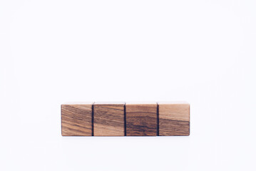 Wooden cubes. ZD blocks made of wood. On a white background. Designer. Empty space for writing.