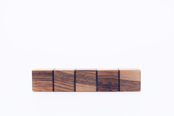 Wooden cubes. ZD blocks made of wood. On a white background. Designer. Empty space for writing.