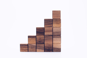 Wooden cubes. 3D blocks of wood in the shape of a pyramid. On a white background. Designer. Steps to achievement