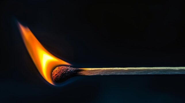Burning match on a black background