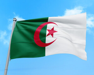 Algeria flag fluttering in the wind on sky.