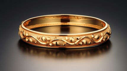 Indian design through a visually striking composition featuring a gold bangle isolated on a black background, portraying the elegance and craftsmanship of the cultural jewelry.