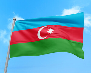Azerbaijan flag fluttering in the wind on sky.
