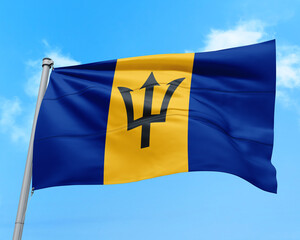Barbados flag fluttering in the wind on sky.