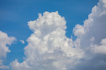 Naklejka na ściany i meble White clouds with cotton texture on blue sky background