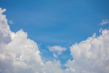Naklejka na ściany i meble White clouds with cotton texture on blue sky background