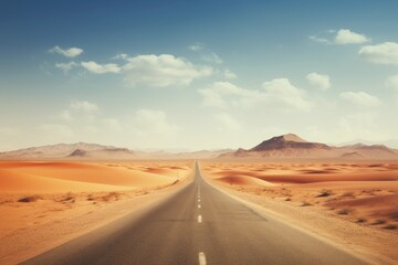 Fototapeta na wymiar A desert highway disappearing into the vastness of arid dunes