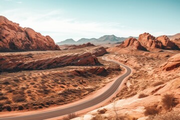 A road winding through a red rock canyon, showcasing natural beauty