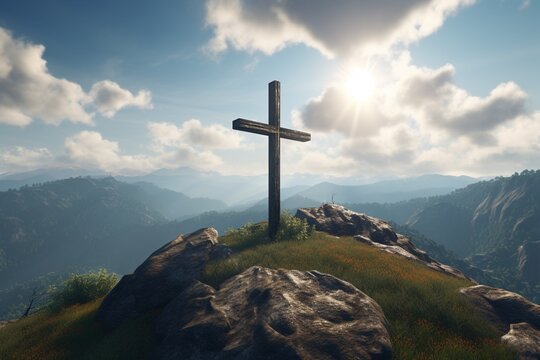 religious cross positioned on a mountain top against the sky and clouds.