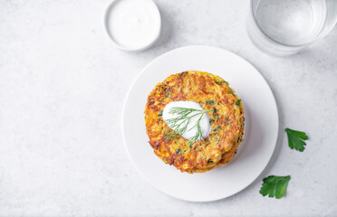 Vegetable pancakes with sauce in a plate