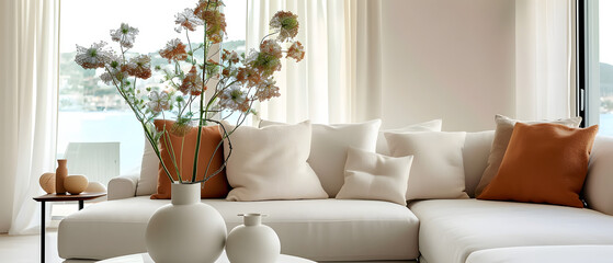 fabric sofa with white and terra cotta pillows. French country home interior design of modern living room
