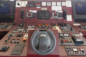 Ship's control device. Engine control from navigational bridge. Focused on helm, blured background. - obrazy, fototapety, plakaty