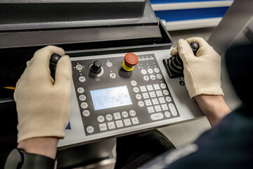 A worker operates a 3D optical measuring machine to ensure high quality and accuracy of...