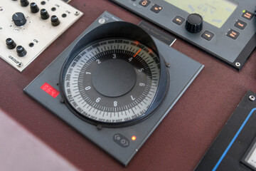 Gyro compass repeater on the navigational control pane of navigational bridge. Navigational equipment.