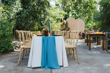 Table and chairs in the garden, party celebration setup.