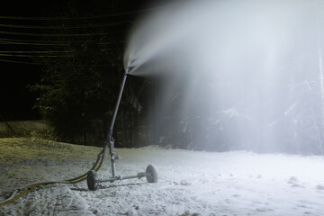 Artificial snow.The snow cannon is in operation. Production of artificial snow.