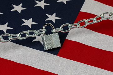 United States flag with chain and lock. Border security, immigration reform and illegal migrant...